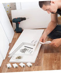 Man assembling furniture with versatile cotter pin clips set for trailer hitches and equipment, spring fasteners visible.