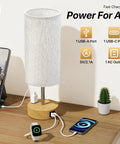Bedside Lamp With USB A And C Ports And AC Outlet, 3 Way Dimmable Touch Lamp, Linen Fabric Shade, charging devices on desk.
