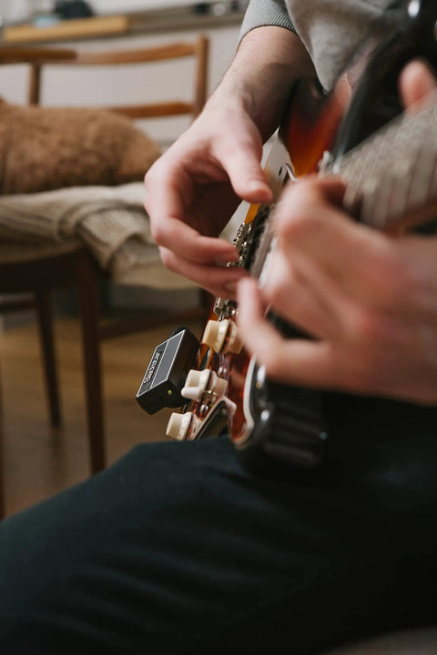 Playing guitar with Compact Electric Guitar Headphone Amplifier With Full Analog Circuitry Clean Crunch And Lead Channels