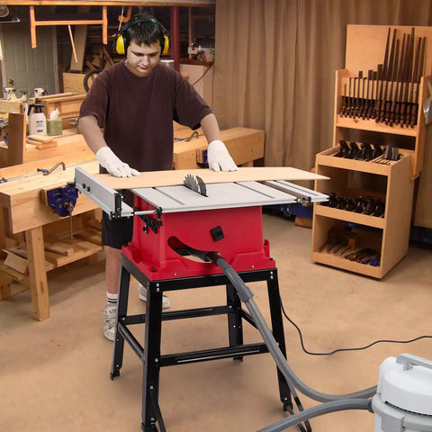 10 Inch 15 Amp Tough Job Site Table Saw With Rock Solid Stand And Push Stick used for precise cuts on wood in workshop.