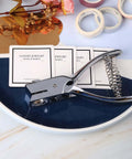 Go-To All Metal Single Hole Puncher With Lever on desk, punches up to eight A4 sheets, oval hole 0.59x0.16 inch, ideal for office use.