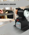 Fafeicy Portable Mini Bench Grinder 7000 Rpm Cordless Electric Sander for sharpening tools, showing dual grinding wheels.