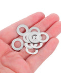 Ultra Thin Stainless Steel Flat Washers Set, 8x14x0.1mm Spindle Shims, 100 Pcs, Door Knob Repair Spacers, DIY Home Hardware Maintenance, Durable, Corrosion Resistant, Slim Fit for Tight Installations, shown in hand