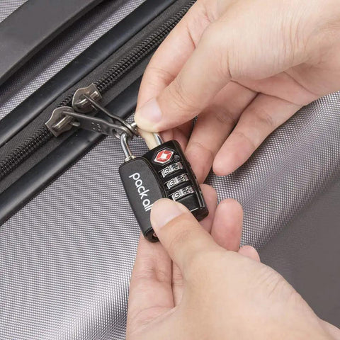 Person securing suitcase with 4 Pack TSA Approved Luggage Lock With 3 Digit Combination, Alloy Body Travel Padlock, Red Indicator