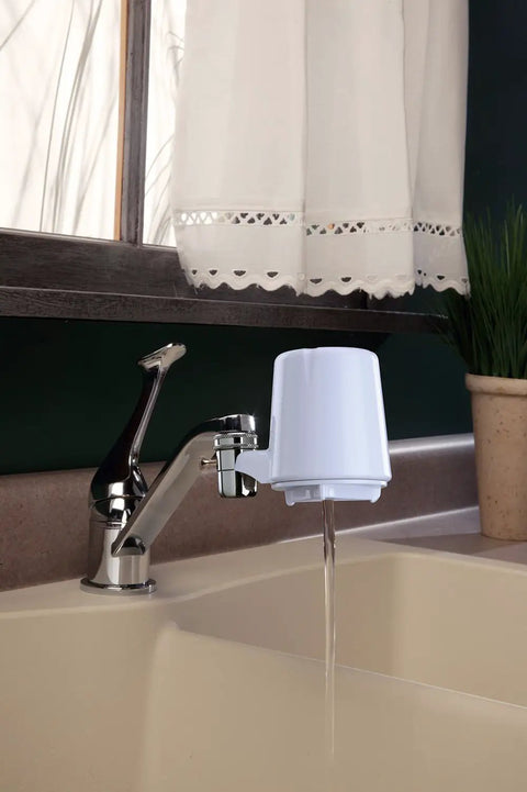 Faucet Mount Water Filter With Advanced Filtration installed on sink, white finish, delivering clean water, easy install at home.