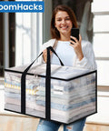 Woman holding Heavy Duty Clear Moving Bags With Reinforced Handles And Double Zippers, Large Storage Totes, clear with clothes inside
