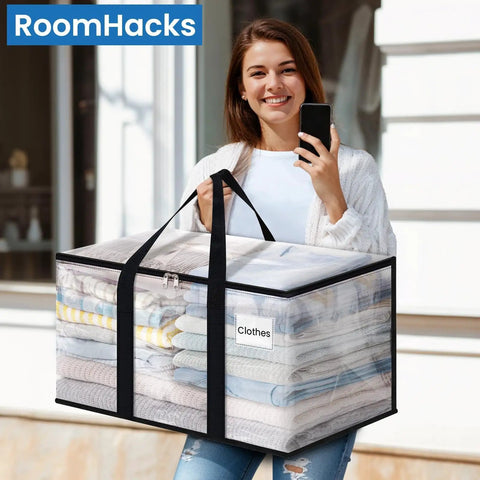 Woman holding Heavy Duty Clear Moving Bags With Reinforced Handles And Double Zippers, Large Storage Totes, clear with clothes inside