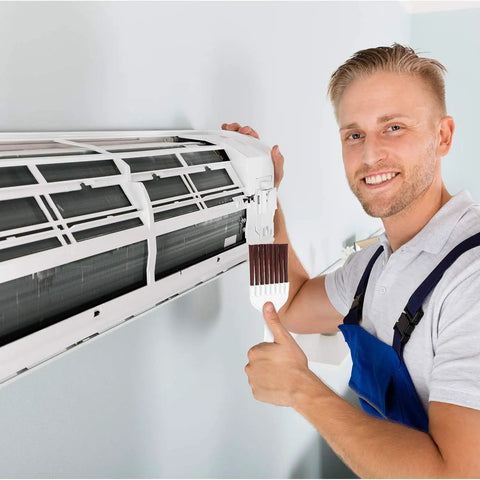 Person using 4 Pack Coil Brush Set For Air Conditioner Condenser And Refrigerator Cleaning HVAC Coil Cleaner on air conditioner fins