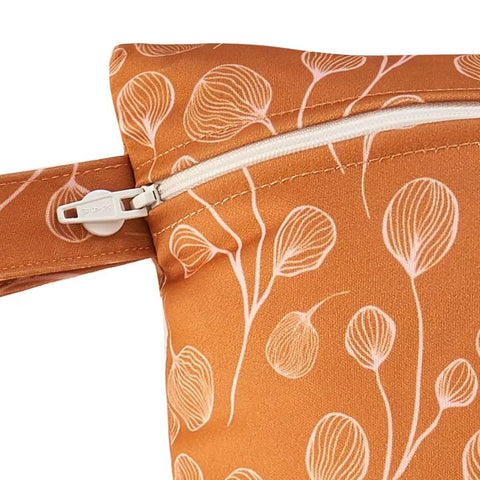 Close-up of zipper on Three Piece Waterproof Wet Bag Storage Set For Baby And Travel with orange floral pattern and TPU material.