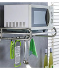 Heavy Duty Six Hook Wall Mounted Coat Rack Super Sturdy Vertical Entryway Organizer with kitchen tools and a microwave.