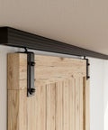 8Ft Ceiling Mount Box Rail Barn Door Hardware Kit With Heavy Duty Aluminum Sliding Track And Matte Black Finish, showing track above wooden door.