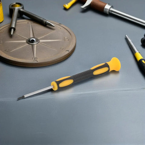Pocket Sized Fencing Sword Tip Screwdriver With Anti Slip Handle on a table with tools