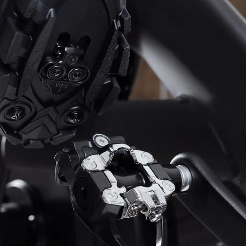 Close-up of SPD Pedal Adapters For Peloton Turn Look Delta Pedals Into SPD Toe Clip Cages With Cleats Included, black