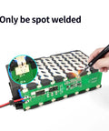 Slam Dunk 48V DIY Battery Case Kit With 30A BMS Guard showing the internal components and spot welding point for secure assembly.