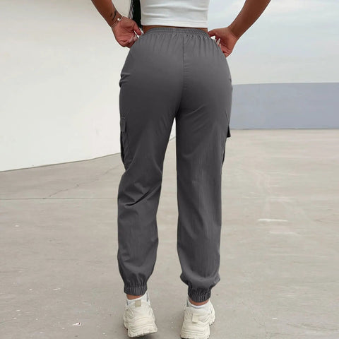 Back view of Women Lightweight Quick Dry Cargo Hiking Pants With High Waist Fit All Day Comfort Stretchy Parachute Style Baggy Travel Joggers.