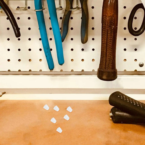 White Plastic Hole Plugs 100 Pack Screw Hole Cover Caps For Cabinets And Furniture Quick No Fuss Install with tools on pegboard