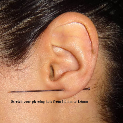 G23 Titanium Threadless Piercing Taper Kit for ear stretching shown in use, nickel-free hypoallergenic 16G taper in ear lobe.
