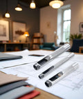 Three Piece Grommet Hole Punch Set With Steel Hollow Punches for Leatherworking and Crafts on a table with design plans