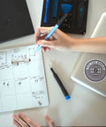 Person using a Slick Magnetic Project Mat With Rewritable Surface For Super Tight Electronics Organization Keep Screws And Parts Sorted In Twenty Zones While You Fix Iphones And Macs Solid Setup.