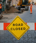 3 Pack Aluminum Road Closed Signs 24 Inch By 24 Inch Pro Grade Reflective Laminated Material With Pre Drilled Holes For Construction Sites Driveways And Streets, front view on barricade at construction site