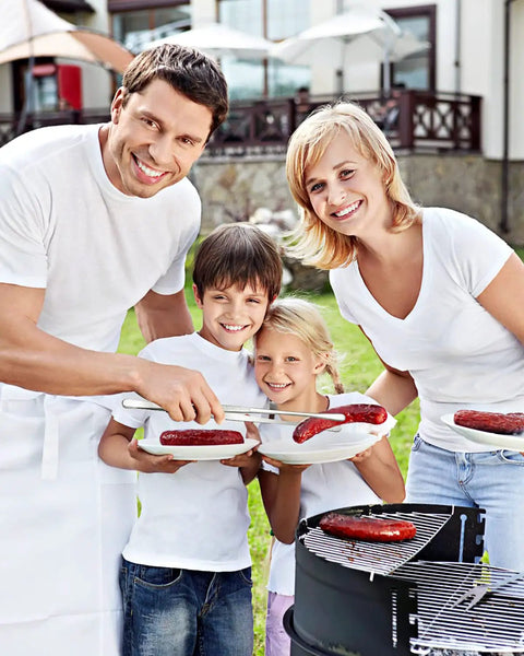 A family grilling sausages using the Two Pack 12 Inch Cooking Tweezers Tongs With Precision Serrated Tips Stainless Steel Chef Tweezers.