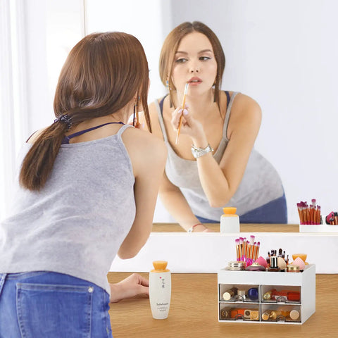 Woman using makeup with Desktop Organizer With Drawer And Multi Compartment Storage Box White on vanity.