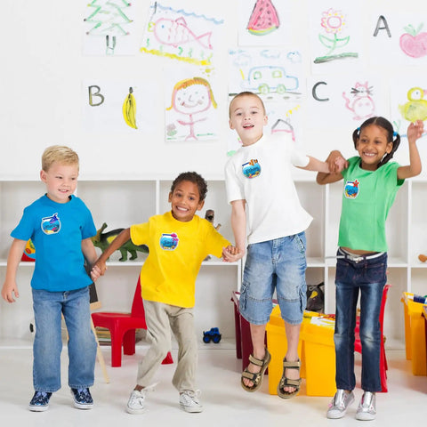 Children in classroom wearing 160 Ocean Animals Name Tag Stickers Set With Eight Cute Sea Creature Designs For Back To School.