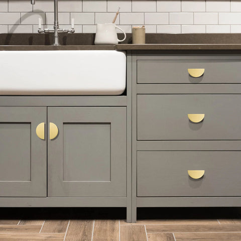 Solid Brass Cabinet Pulls 5 Pack Gold Half Moon Drawer Handles in brushed brass finish installed on kitchen cabinets and drawers