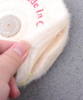 Close-up of Low Noise 6 Inch Cloth Buffing Wheels 2 Pack White Felt Polishing Pads For Grinder with hand holding edge
