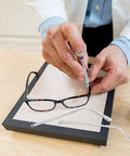 Person repairing glasses with Metal Eyeglass Arms Replacement Pair For Eyewear And Sunglasses With Slip Design For Quick Repairs And Extra Comfort.