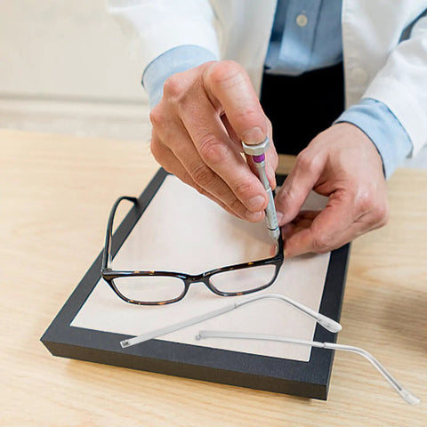 Person repairing glasses with Metal Eyeglass Arms Replacement Pair For Eyewear And Sunglasses With Slip Design For Quick Repairs And Extra Comfort.