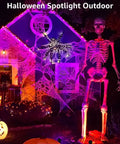 12W RGB Low Voltage Landscape Lights With Remote Control illuminating a Halloween skeleton display with purple and orange colors