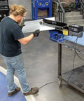 Person using Bead Roller Drive System With 1/6 HP 120V Motor, Variable Speed 0 To 20 RPM, And Foot Pedal Control on metal bead roller