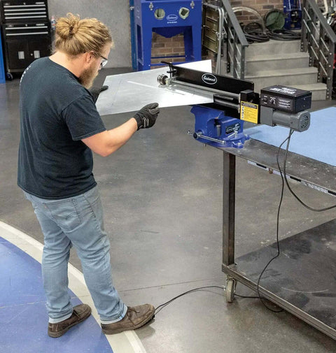 Person using Bead Roller Drive System With 1/6 HP 120V Motor, Variable Speed 0 To 20 RPM, And Foot Pedal Control on metal bead roller