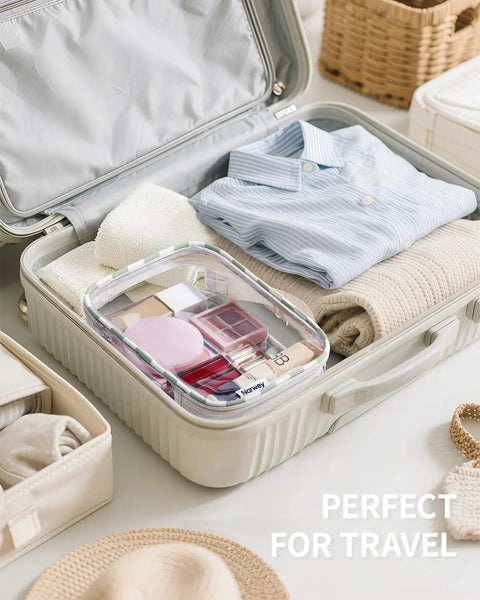 Open suitcase with blue shirt and TSA Approved Clear Toiletry Bag For Carry On, Waterproof PVC Cosmetic Organizer, 7.9 by 5.9 by 2.4 Inches, Airport Security Friendly Quart Size Travel Bag, Mint Green Checkerboard Makeup Case.
