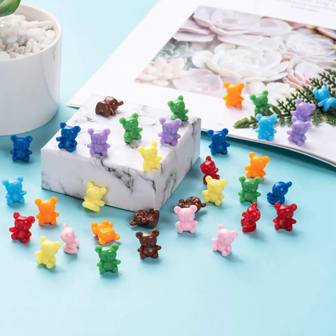 Super Cool Rainbow Counting Bears Set With Nine Rad Colors Perfect For Toddler Math Manipulatives And Preschool Activities Totally Kid Approved Educational Classroom Toys, colorful plastic counting bears on a blue surface.
