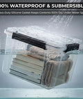 Kickass Heavy Duty 19 Quart Storage Bin With Airtight Gasket Lid Clear Stackable Plastic Crate submerged in water with books and towels inside.