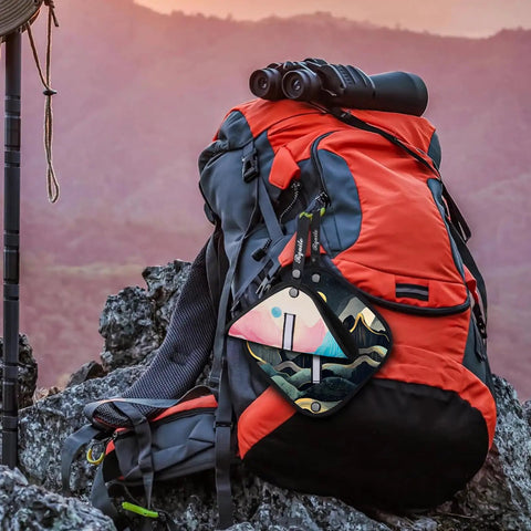Backpack with Two Pack Pee Cloths For Women On The Go attached, featuring colorful design, ideal for hiking and camping.