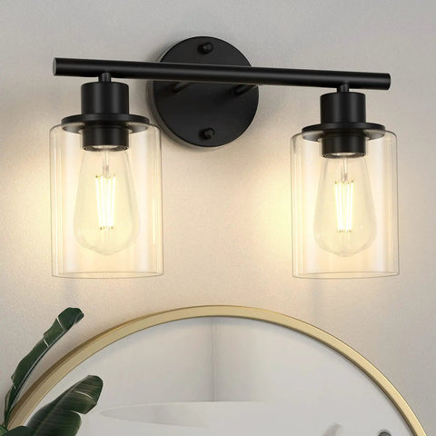 Clear Glass Lamp Shade Replacement 4 Pack, 5.5 Inch Height, 3.9 Inch Diameter on a wall light fixture with black fittings