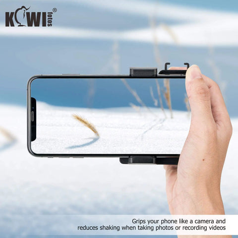 Compact Phone Camera Grip Handle With Tripod Mount Remote Shutter shown gripping a smartphone in snowy landscape for steady video shooting.