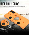 Front view of Respicefinem 35mm concealed hinge jig drill guide set in orange engineering plastic with mounting ring and adapters