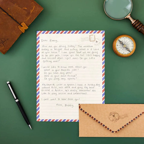 48 Pack Letter Writing Stationery Paper And Envelopes Set With Vintage Travel Design, letter and pen on green surface