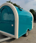 Rollout Ready Custom Towable Food Trailer Commercial Mobile Catering Kitchen With Insulated Walls Heavy Duty Chassis And Turnkey Layout side view in blue color.