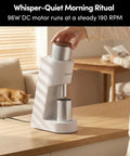 Top Tier Single Dose Coffee Grinder Built For Killer Extraction features sleek design with stainless steel dosing cup on a wooden table.