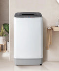 Slick 17.6 Lbs Compact Portable Washer With Clear Led Screen And Ten Program Settings For Swift Laundry Loads In Tight Dorms Or Apartments With Heavy Duty Drain Pump And Smooth Stainless Drum in a modern bathroom setting.
