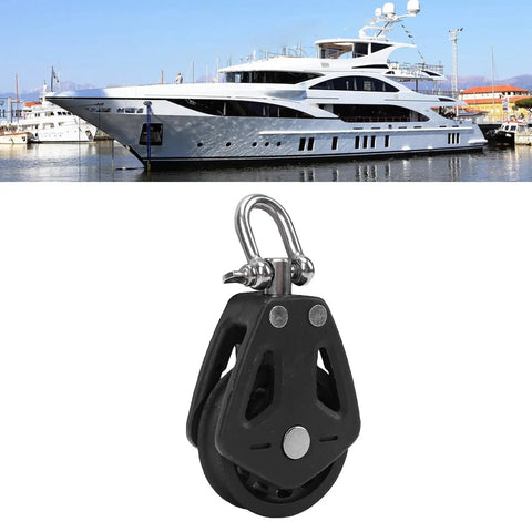 Beefy Nylon Wheel Marine Pulley 50mm Stainless Steel Bearing Single Swivel Sailing Block in front of a yacht