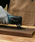 Beast Mode Pro Grade Carbide Oscillating Saw Blades 3 Pack used on wood, showing precise cut with universal multi-tool interface.