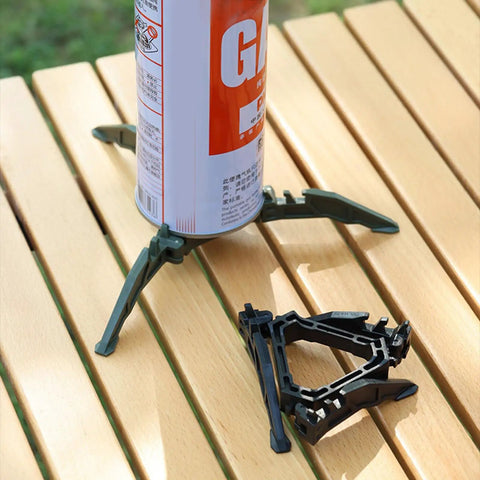 Durable Camping Cookware Canister Stand with Upgraded Nylon Build showing nonslip folding stove support on wooden table
