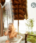 Woman enjoying High Pressure Kickin Rain Shower Head With Handheld Unit 4.5 Inch Shower Head Three Settings in outdoor bath.