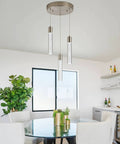 Dining room with Three Light Pendant Fixture In Sleek Silver Finish, showcasing modern dimmable integrated pendant lights.